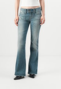 Клешеные джинсы Клешеные джинсы