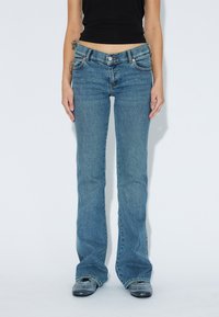 Клешеные брюки Клешеные брюки