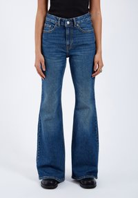 Клешеные брюки Клешеные брюки