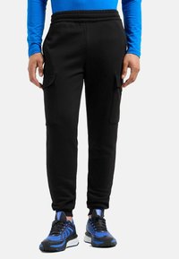 Брюки с накладными карманами Брюки с накладными карманами