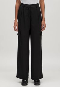 Брюки с накладными карманами Брюки с накладными карманами