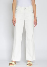 Клешеные джинсы Клешеные джинсы