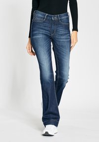 Клешеные брюки Клешеные брюки