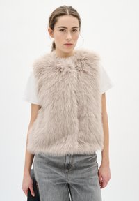 Пуховой жилет Пуховой жилет