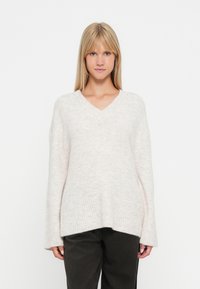 Длинный пуловер Длинный пуловер