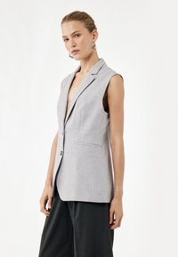 Длинный жилет Длинный жилет