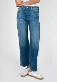 Клешеные джинсы Клешеные джинсы