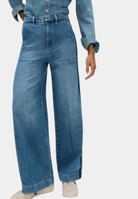 Клешеные джинсы Клешеные джинсы