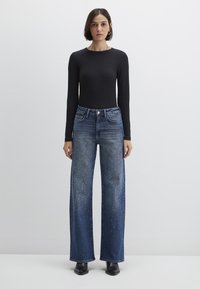 Свободные джинсы Свободные джинсы