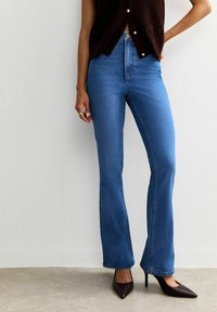 Клешеные брюки Клешеные брюки