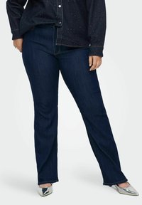 Клешеные джинсы Клешеные джинсы