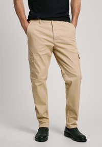 Брюки с накладными карманами Брюки с накладными карманами