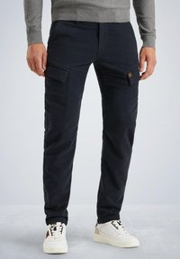 Брюки с накладными карманами Брюки с накладными карманами