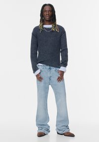 Клешеные джинсы Клешеные джинсы