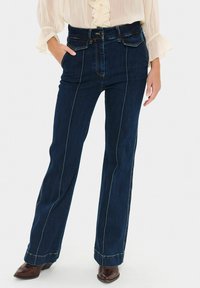 Клешеные джинсы Клешеные джинсы