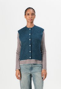 Джинсовая жилетка Джинсовая жилетка