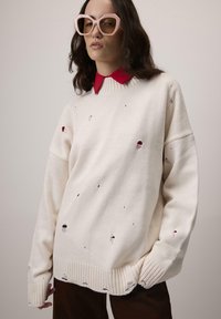 Длинный пуловер Длинный пуловер