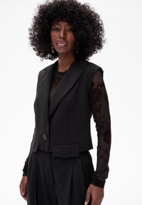 Жилет Жилет