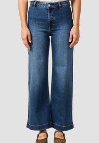 Клешеные джинсы Клешеные джинсы