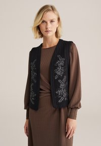 Жилет Жилет