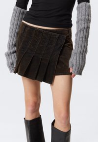 Юбка с накладными карманами Юбка с накладными карманами