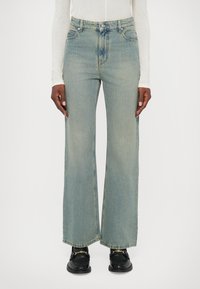 Клешеные джинсы Клешеные джинсы